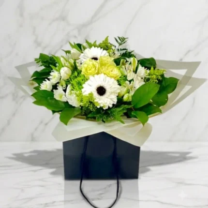 White elegant bouquet in a water wrap for Downtown Vancouver delivery.