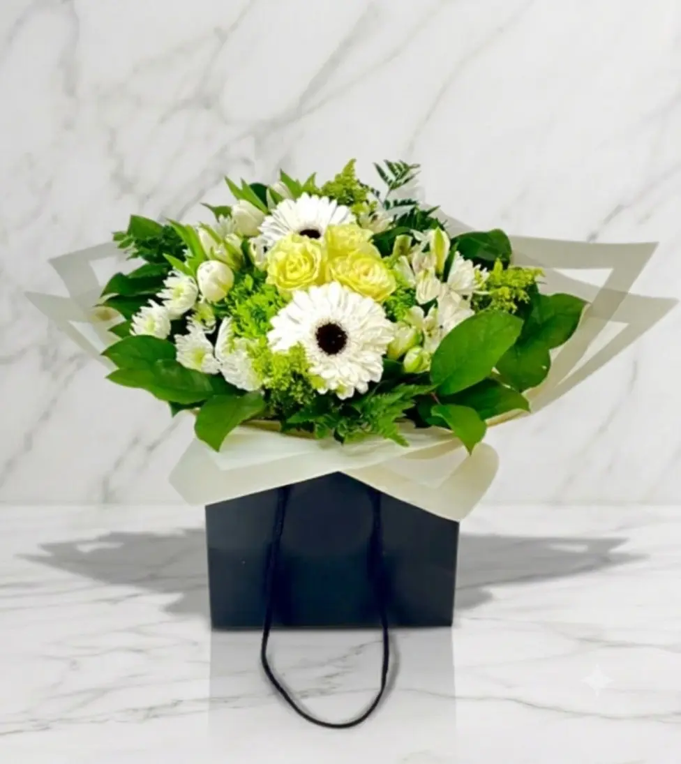 White Water-Wrap Bouquet White elegant bouquet in a water wrap for Downtown Vancouver delivery.