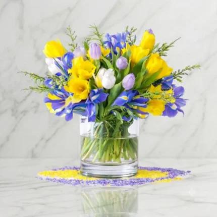 Yellow tulips and purple irises in a vase for Downtown Vancouver delivery.